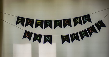 hanging sign saying everyone can code